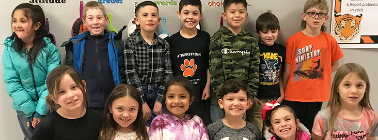 Second grade class group photo in the classroom